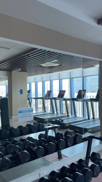 Fitness centre with treadmills and free weights available to 38 Park Avenue guests